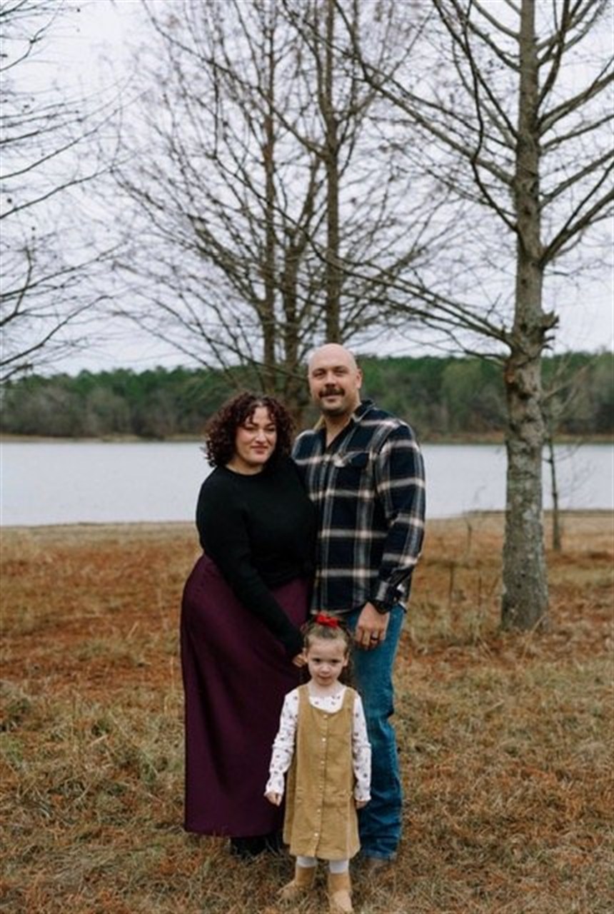 Aaron Porter with his wife and daughter